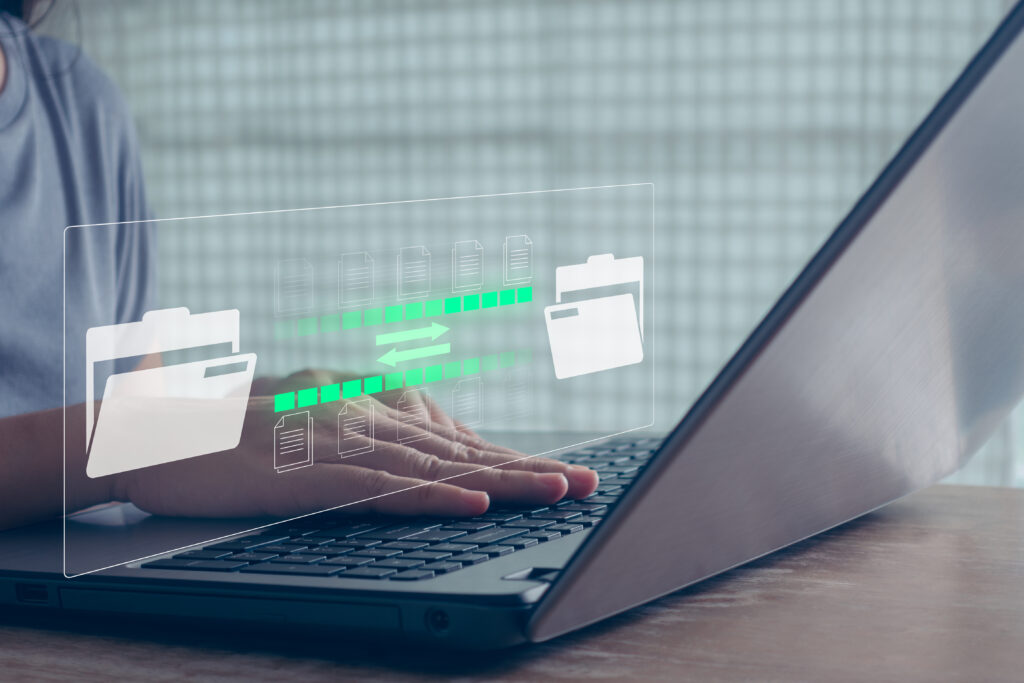 Woman hand transferring files in virtual screen for Send of document on internet. Data transfer, Transfer file of data between folder, Backup data, Exchange of file on folder, DMS. Virtual document.